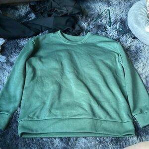 green crewneck, it don’t have a tag on it so i don’t remember where it’s from,